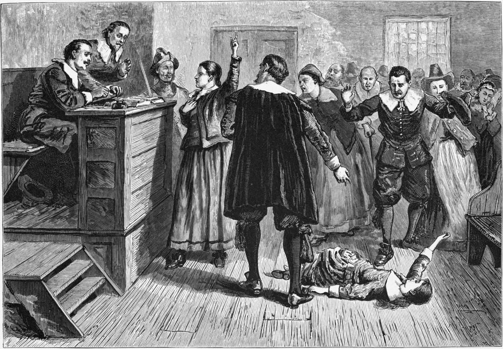 La sorcellerie au village de Salem. Gravure. Le personnage central de cette illustration de 1876 représentant la salle d'audience est généralement identifié comme étant Mary Walcott.